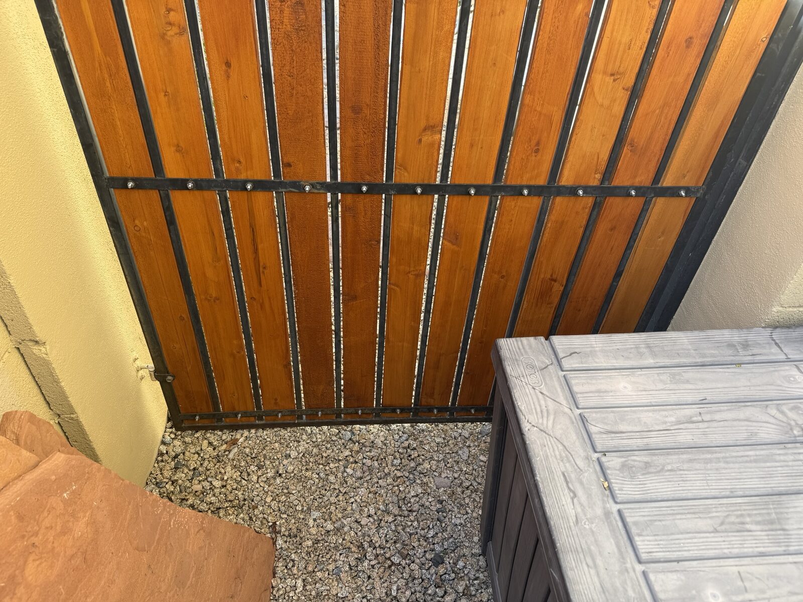 Before: side gate with an open gap at the bottom